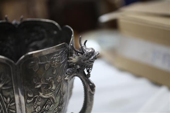 A late 19th/early 20th century Chinese Export silver small jardinere, on three dragon handle supports by Wang Hing, Hong Kong.